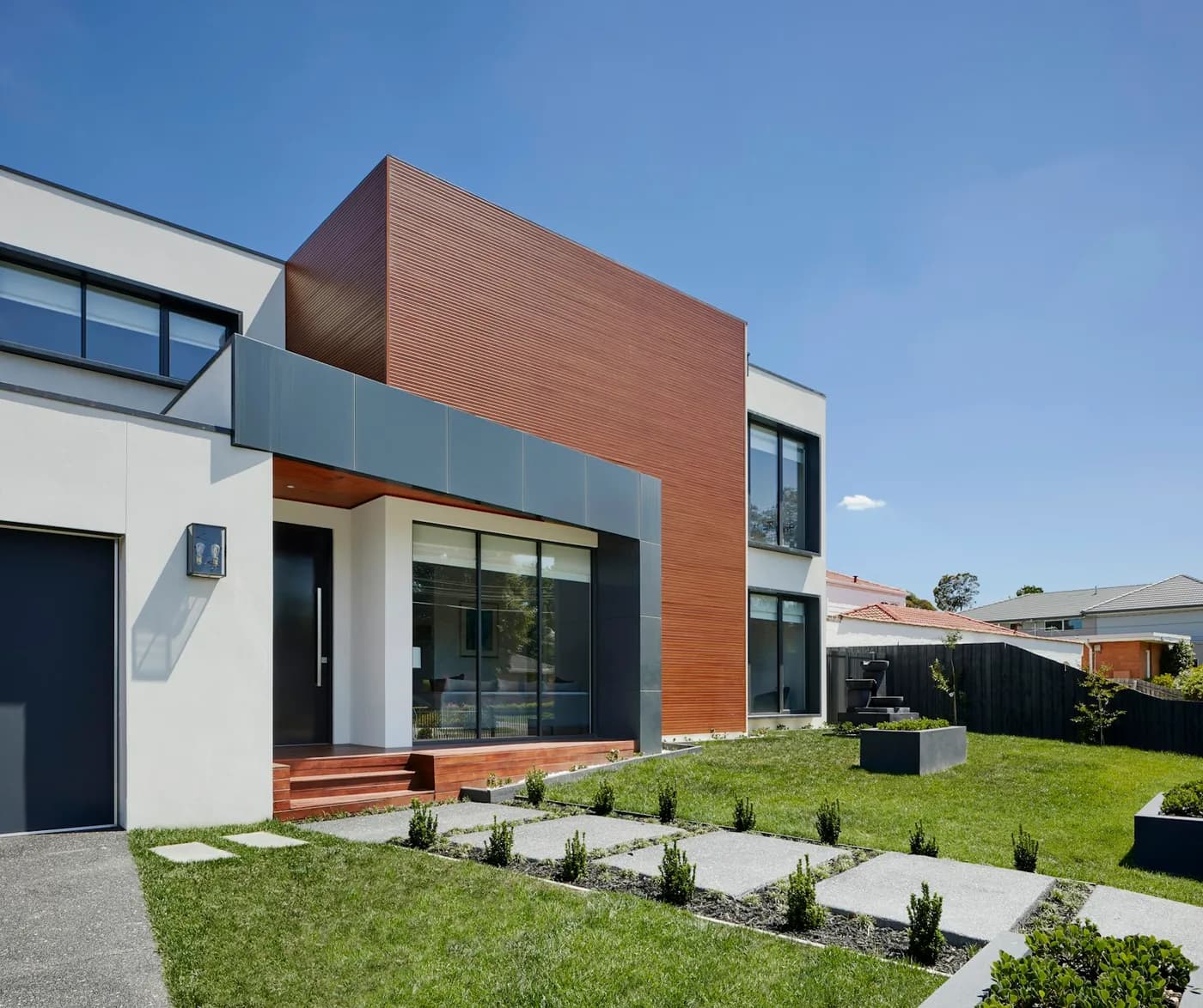 The two-story modern home after its second-story addition